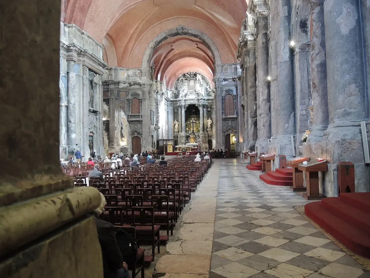 The scorched, cracked stone pillars and vaulted nave inside the Church of St. Dominic in Lisbon, left deliberately unrestored