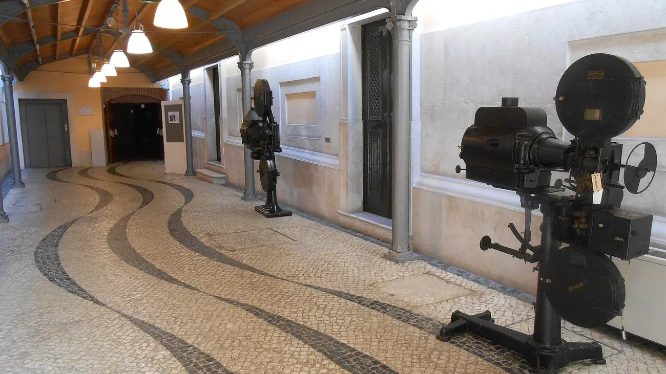A vintage film projector on display in a corridor of the Cinemateca Portuguesa in Lisbon