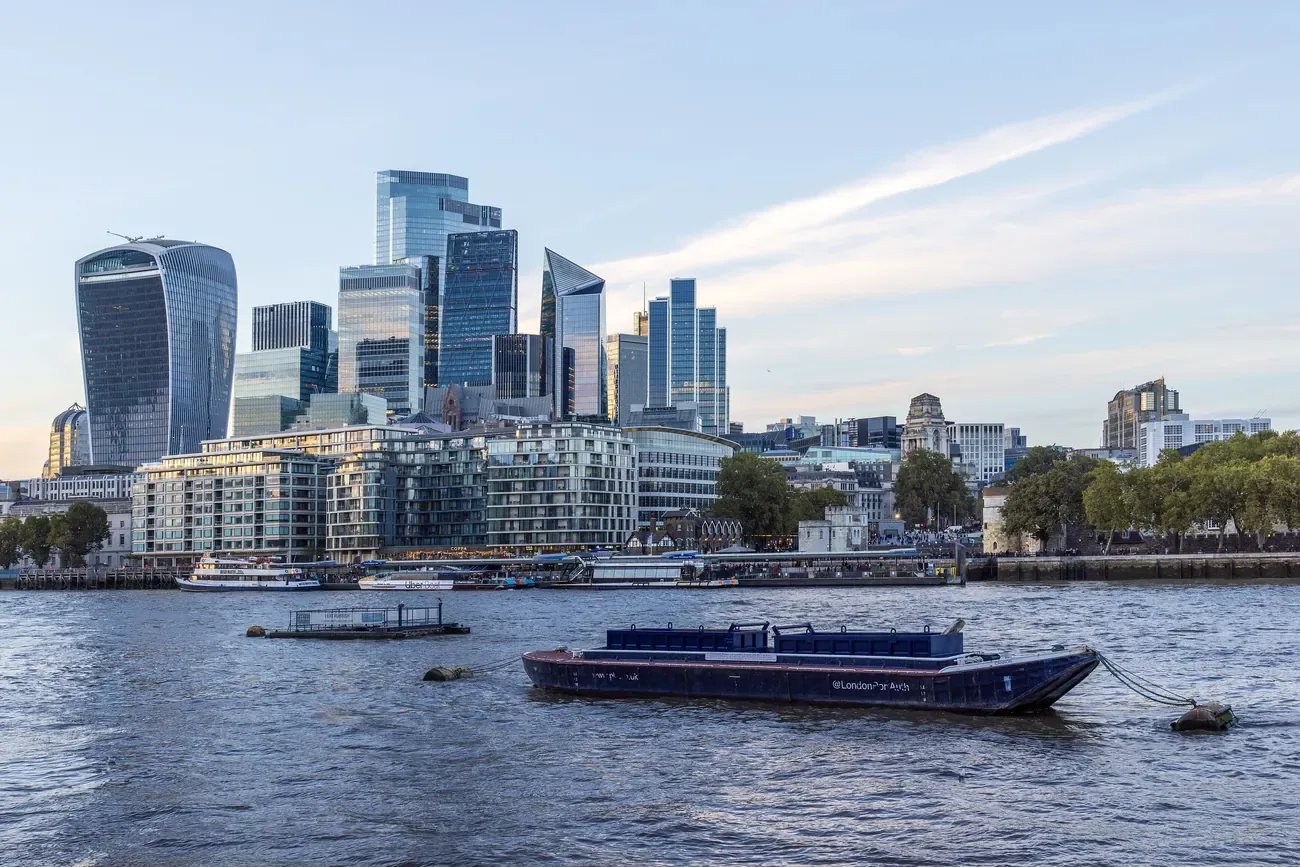 The City of London tower cluster, including 8 Bishopsgate, the Walkie-Talkie and 22 Bishopsgate, seen across the Thames from the Queen's Walk