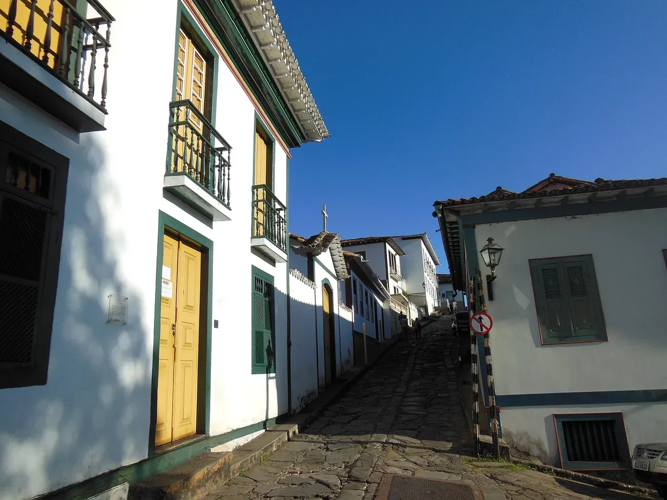 A cobbled colonial street with wooden balconies in Diamantina, Minas Gerais
