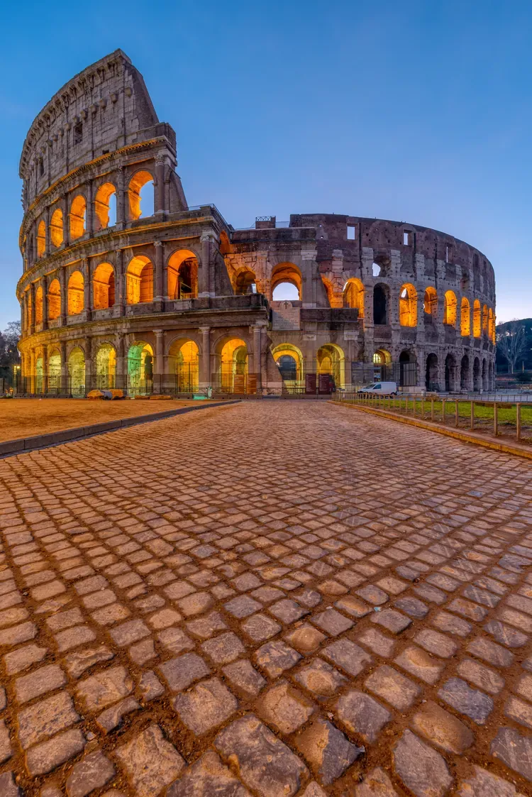 The Colosseum in Rome illuminated at dawn