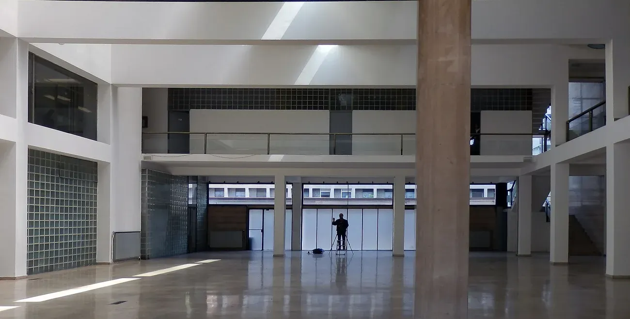 The bright double-height interior hall of the Casa del Fascio in Como