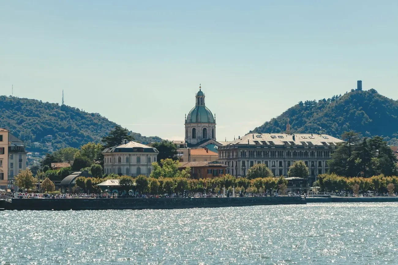 Como's lakefront and the dome of Como Cathedral seen from Lake Como, Italy