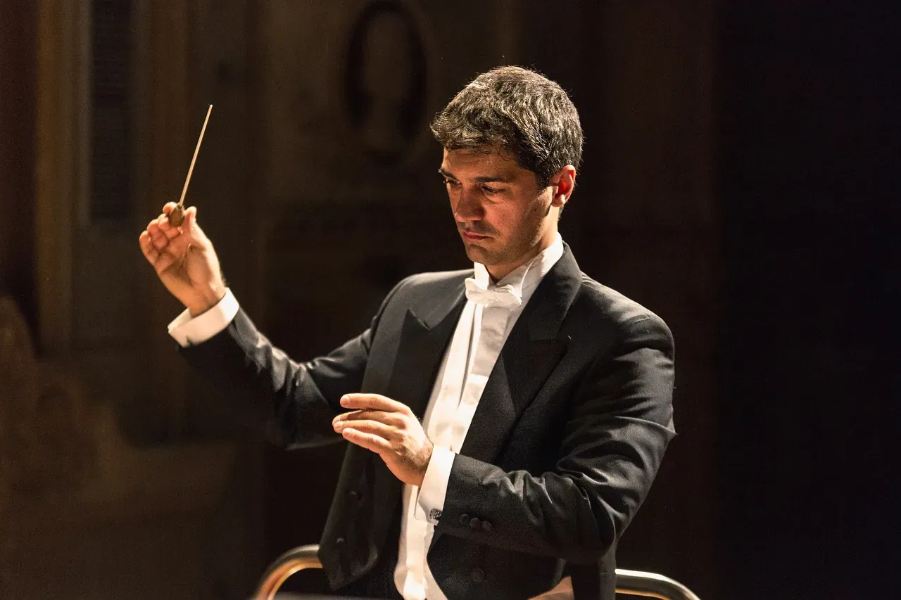 Conductor leading a classical concert