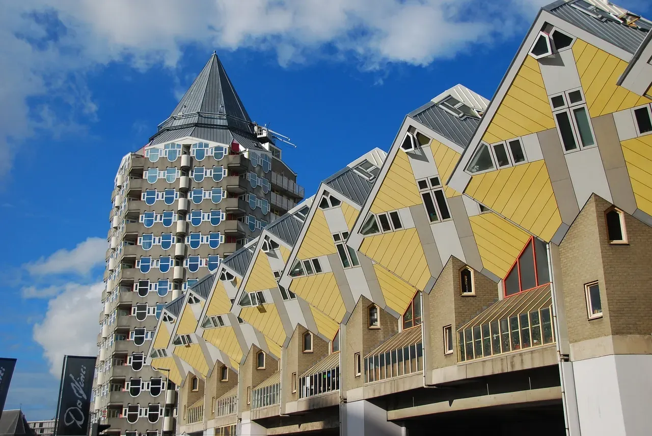 The tilted yellow cube houses and the round Blaak tower block beside them in Rotterdam