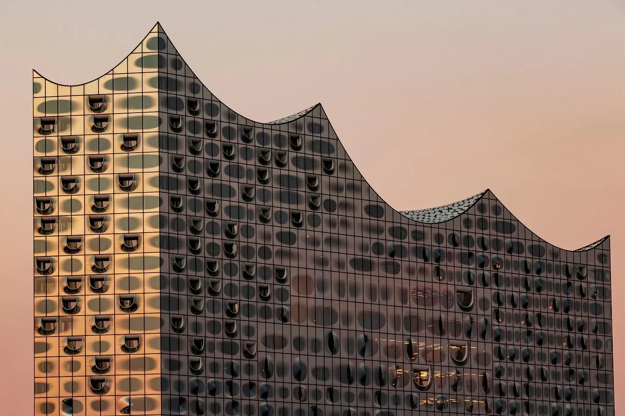 Curved glass panels and the wave roofline of the Elbphilharmonie in Hamburg