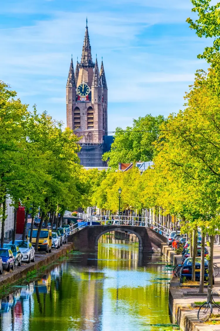 The Oude Kerk church seen behind a canal in Delft, Netherlands