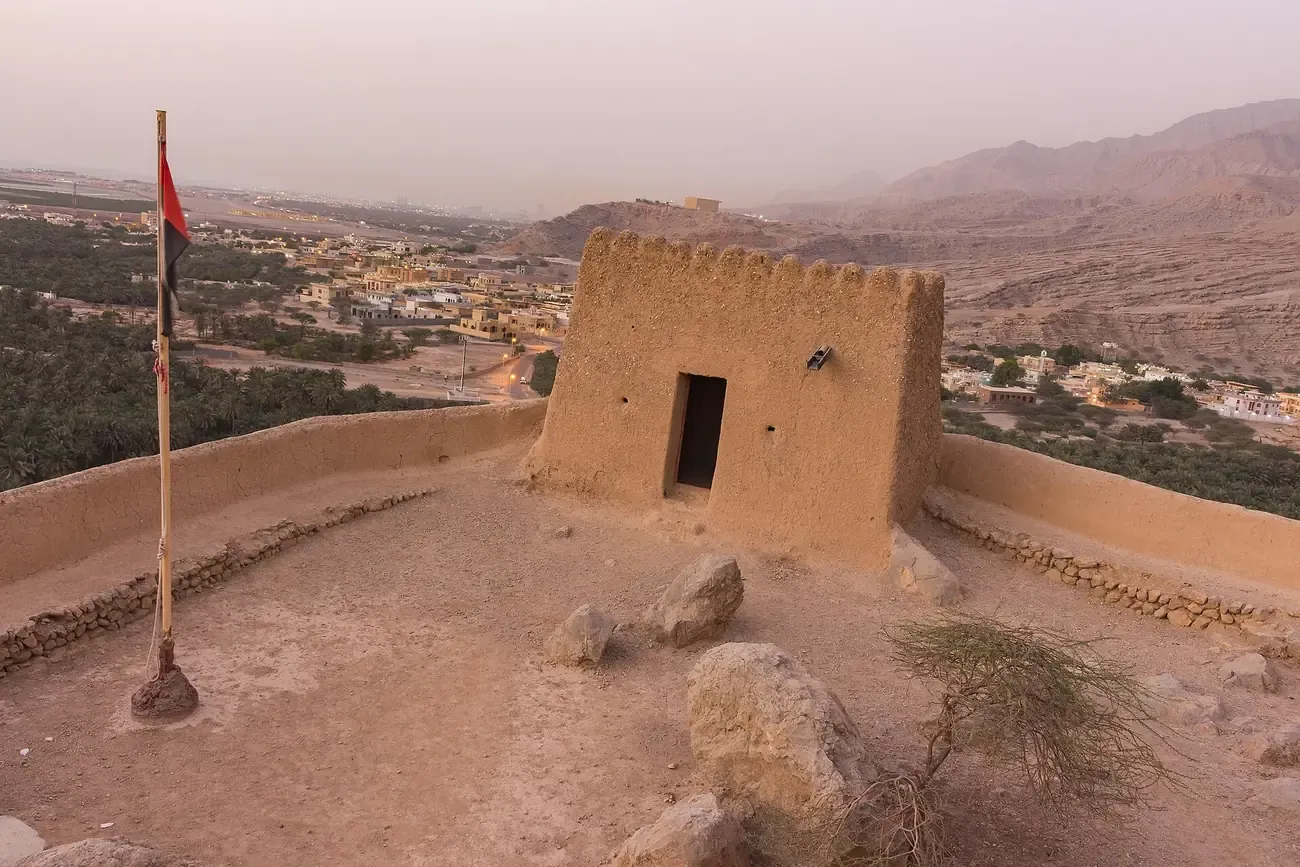 Dhayah Fort on its hilltop above the palm plain of Ras Al Khaimah