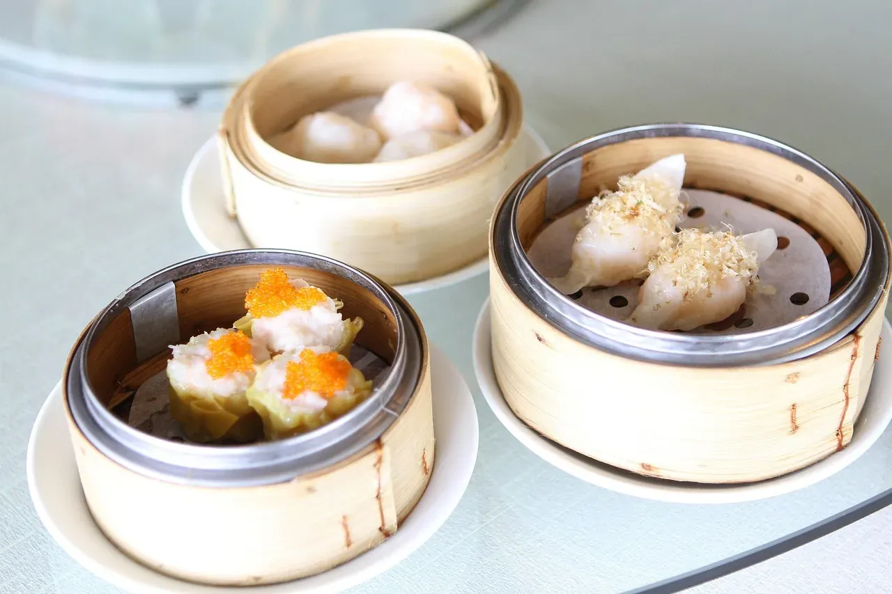 Bamboo steamer baskets of siu mai and har gow dim sum