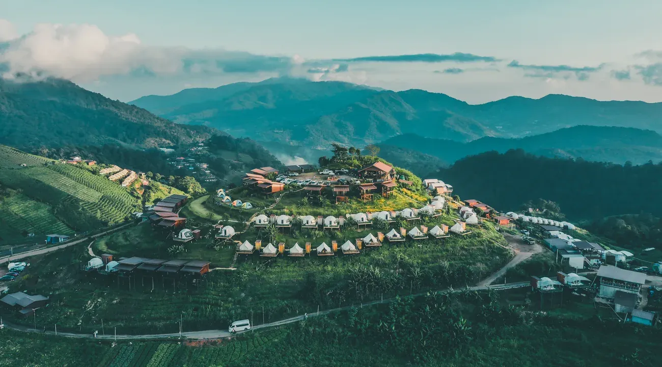 Aerial view of the Doi Mon Jam hilltop viewpoint and tents, Chiang Mai