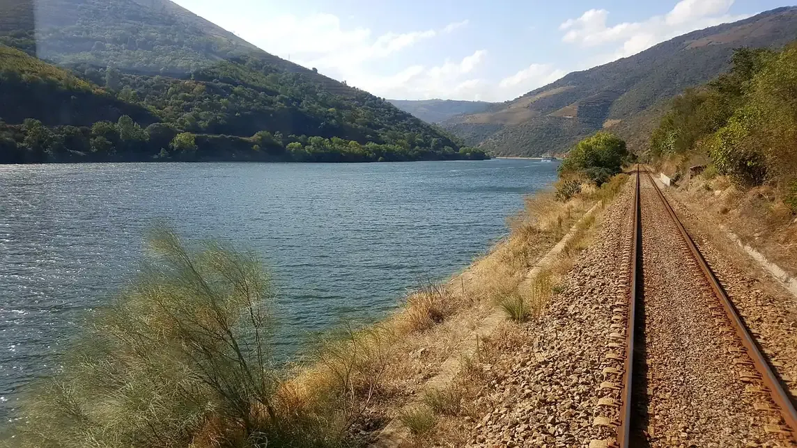 The Douro line railway running along the river bank