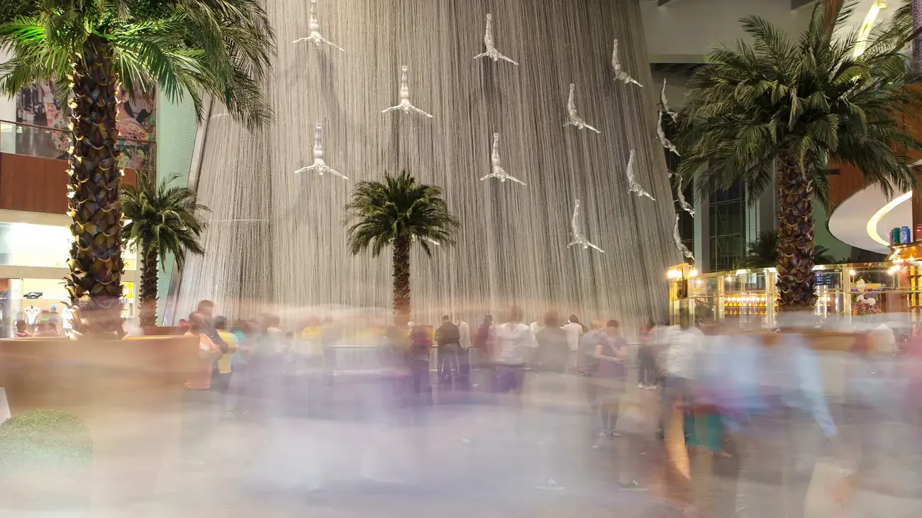 The indoor waterfall with its diving sculptures inside the Dubai Mall