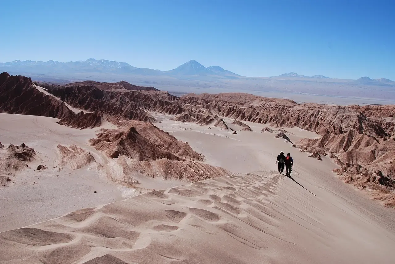 Walkers on the great dune of the Valle de la Luna near San Pedro de Atacama