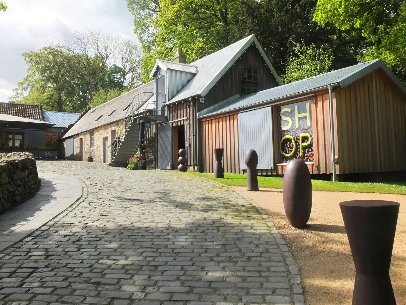 Converted farm steading buildings and cobbled courtyard at Jupiter Artland near Edinburgh