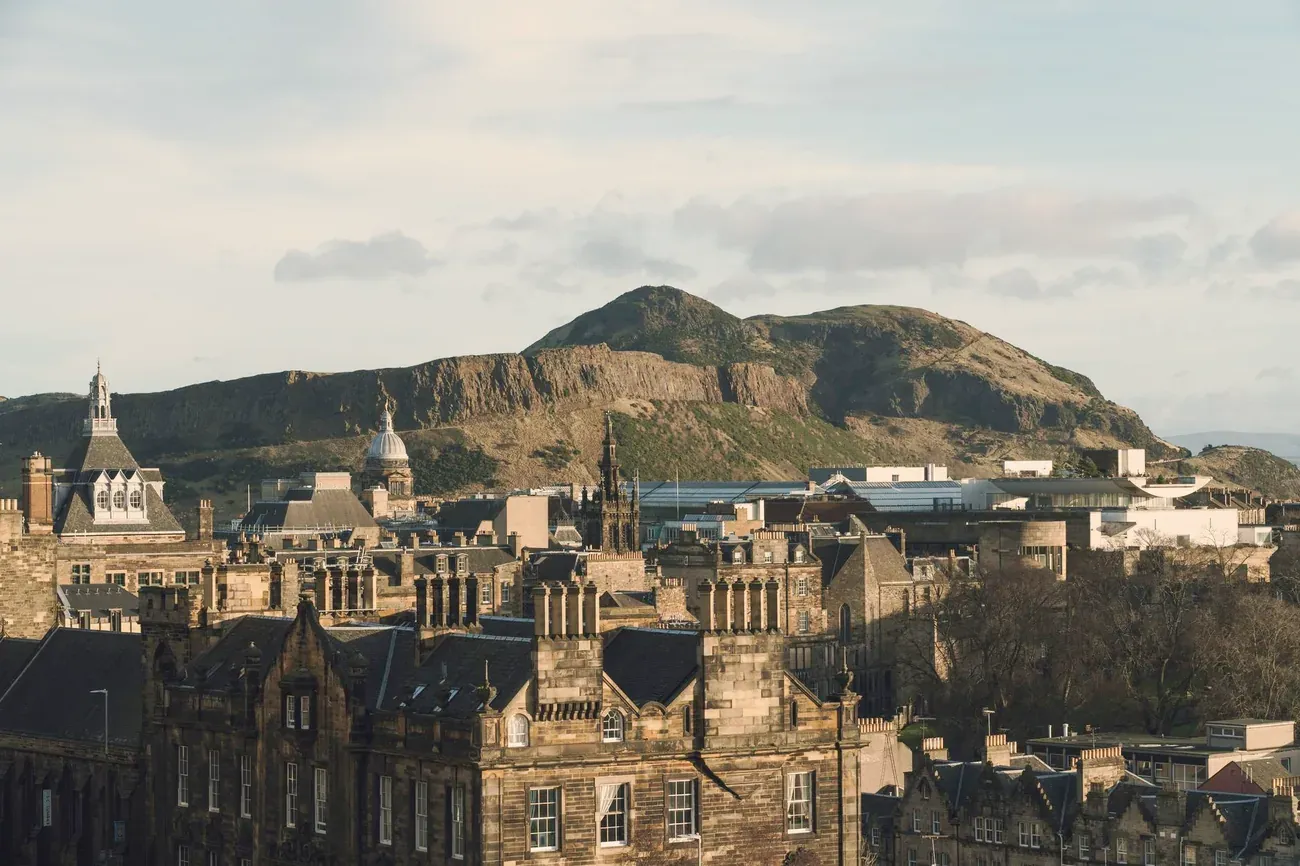 Edinburgh Old Town rooftops with Salisbury Crags and Arthur's Seat behind, Scotland
