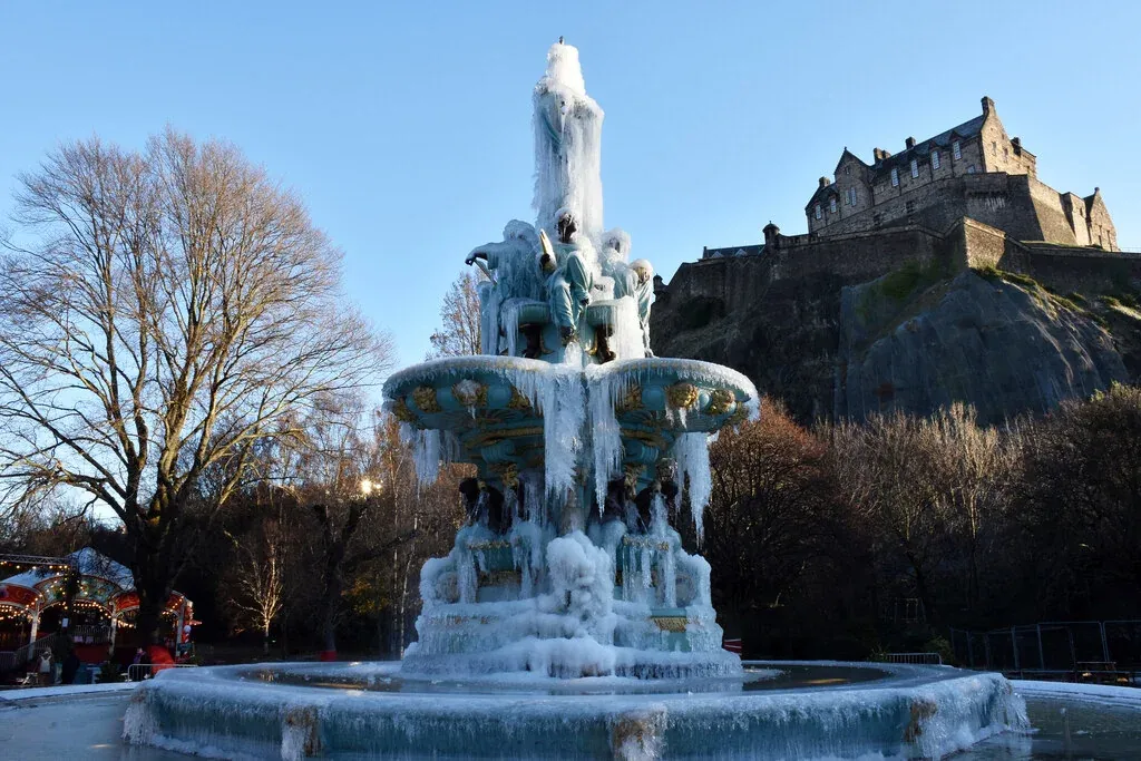 The frozen Ross Fountain in West Princes Street Gardens below Edinburgh Castle in December