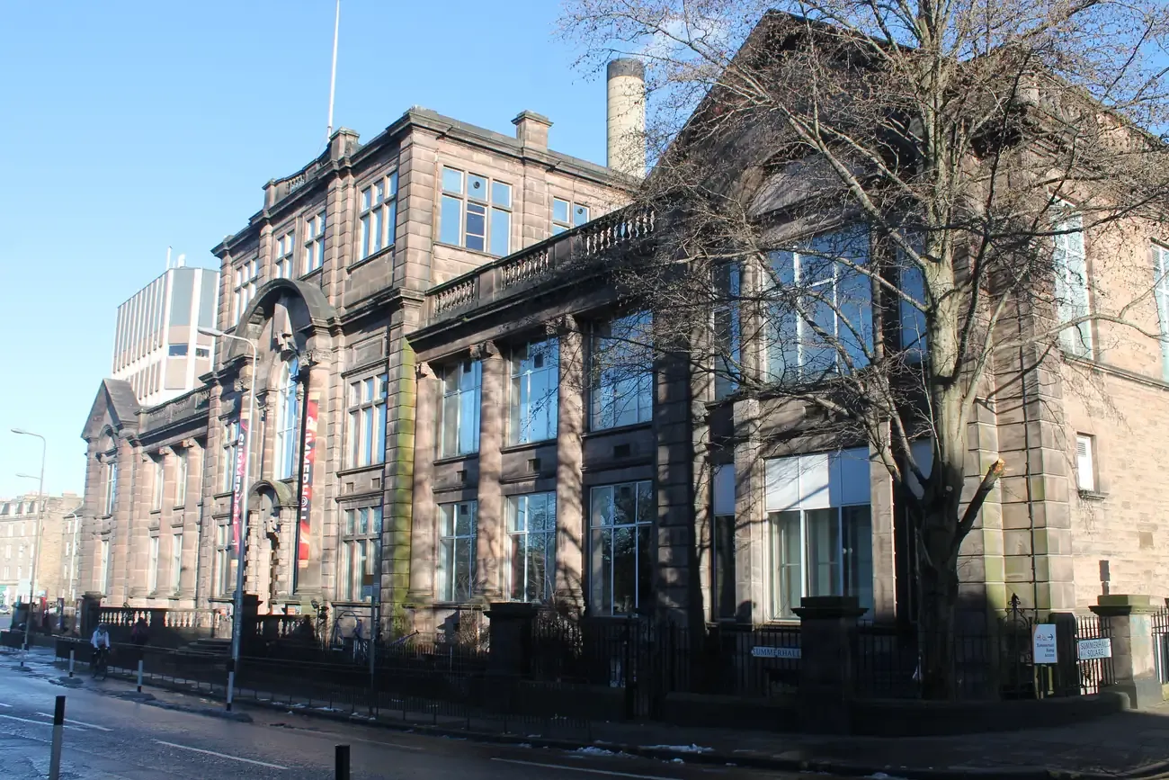 The stone facade of Summerhall arts centre in Edinburgh on a winter day