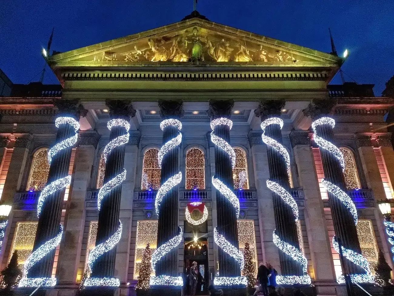 The Dome on George Street, Edinburgh, with its pillars wrapped in Christmas lights at night
