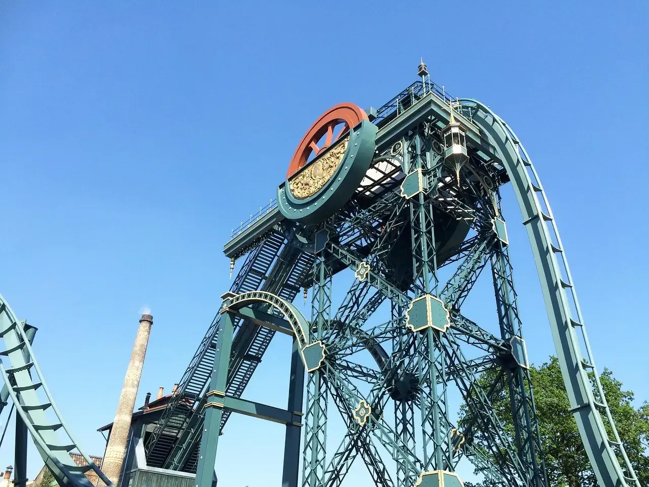The steel tower and clock face of a dive coaster at Efteling in Kaatsheuvel