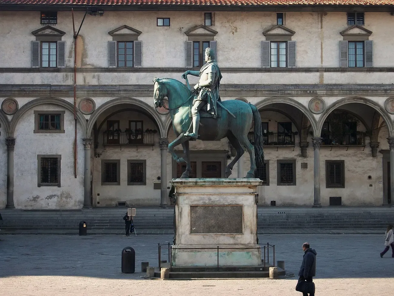 The bronze equestrian statue of Ferdinando I de' Medici in front of the Ospedale degli Innocenti in Piazza della Santissima Annunziata, Florence