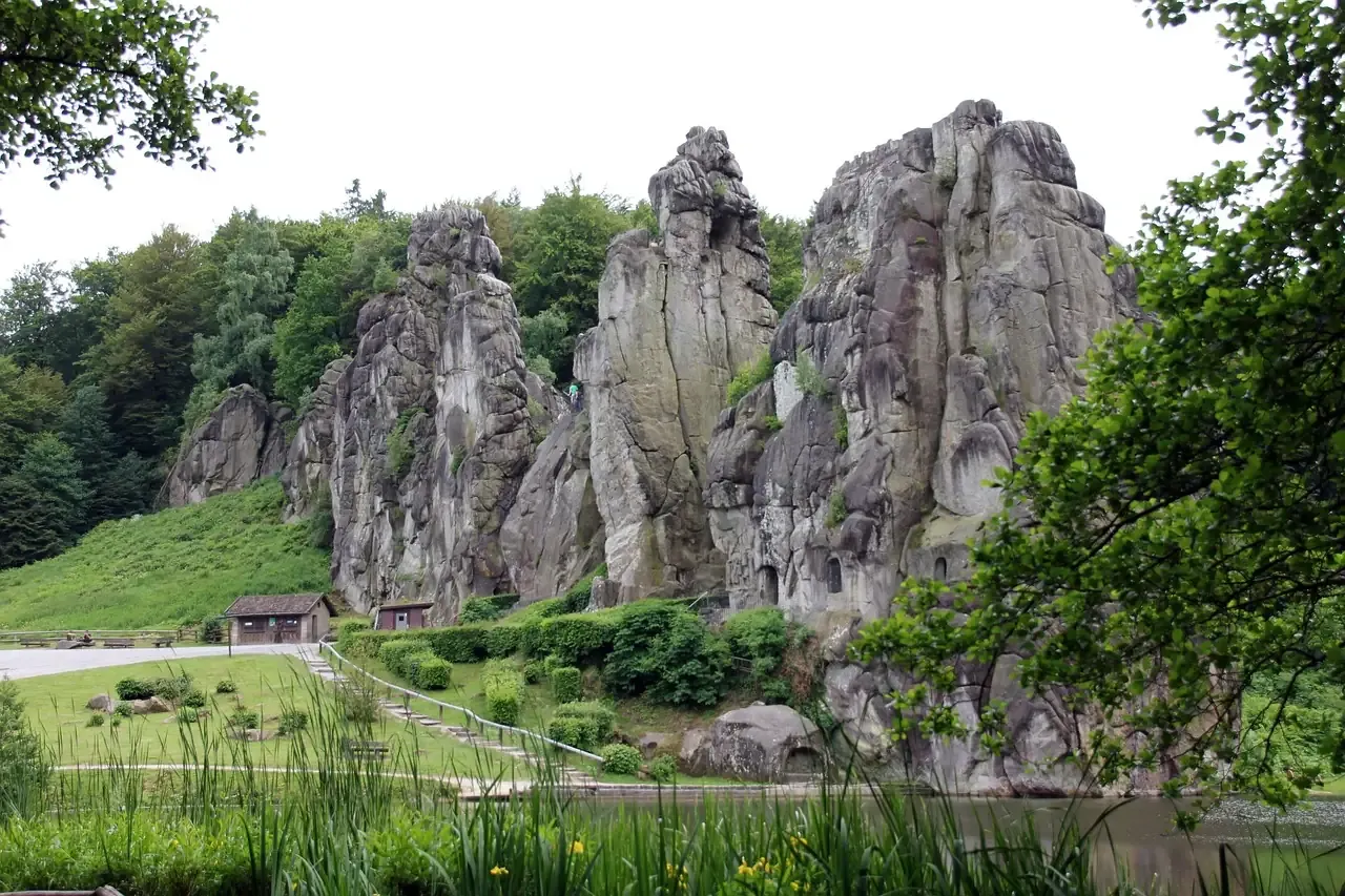 The Externsteine sandstone pillars rising from a meadow in the Teutoburg Forest