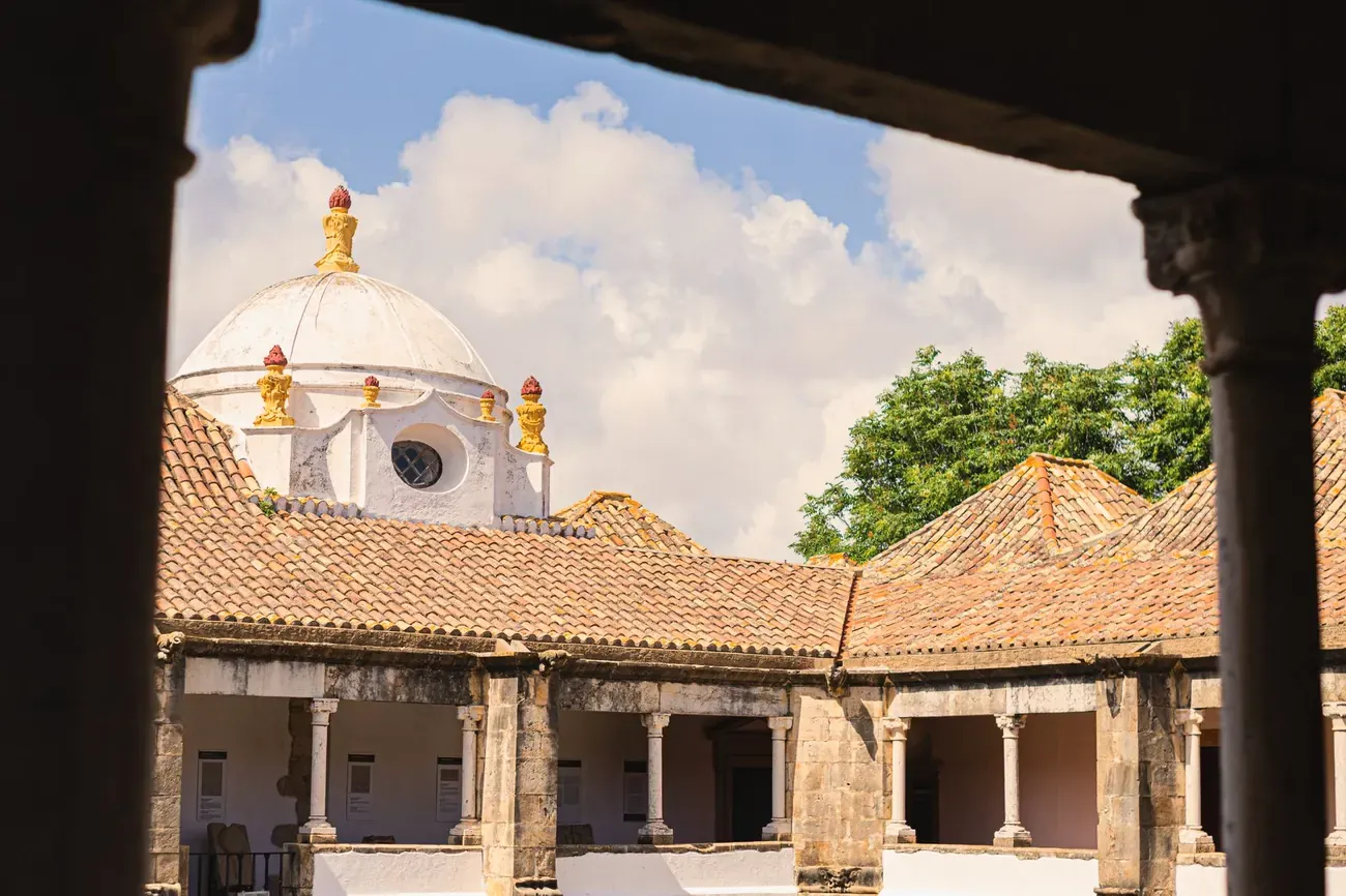Renaissance cloister courtyard and white dome in the old town of Faro, Portugal