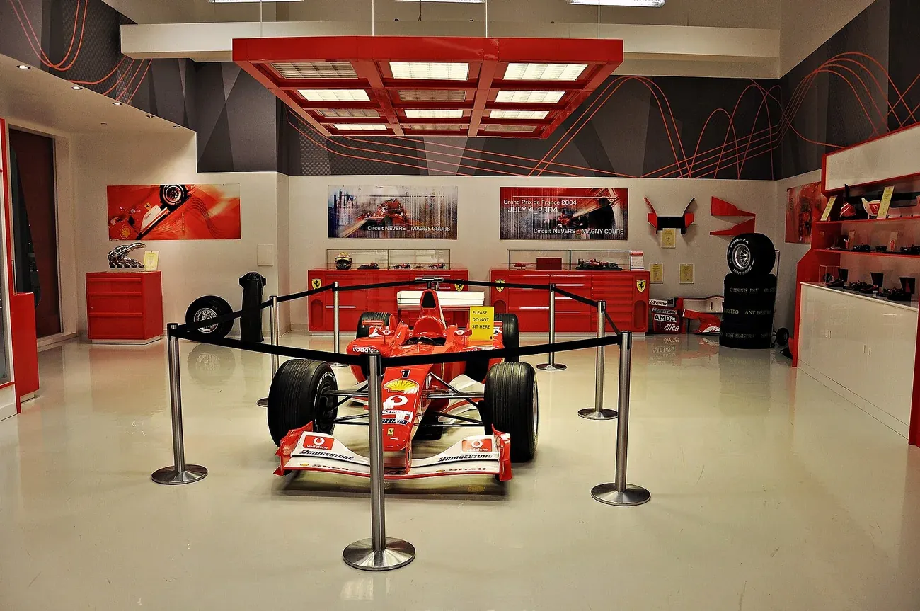 Red exhibition hall with racing cars inside Ferrari World Abu Dhabi