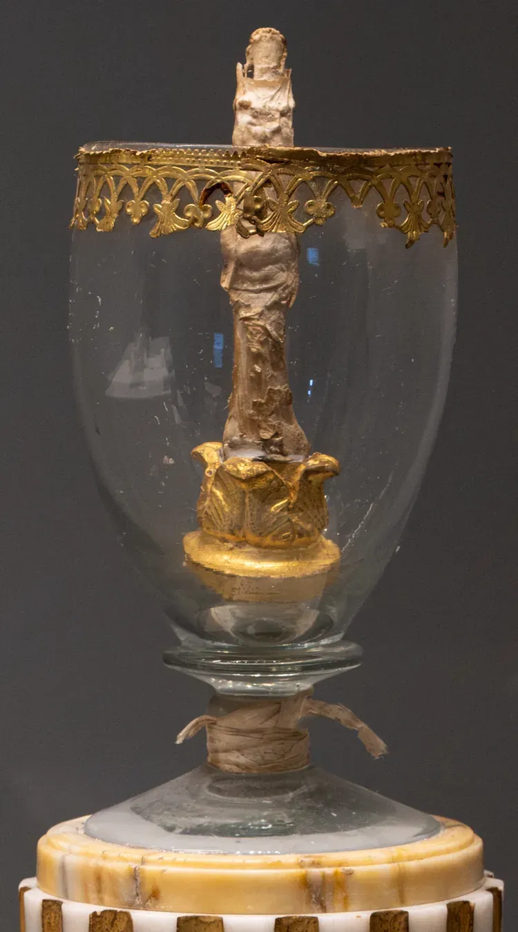 Galileo's middle finger standing upright in its glass egg reliquary at Museo Galileo in Florence