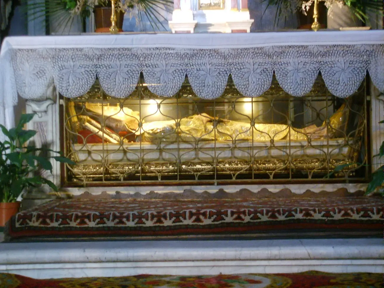 The glass coffin containing the body of Saint Antoninus in his robes at the Church of San Marco in Florence