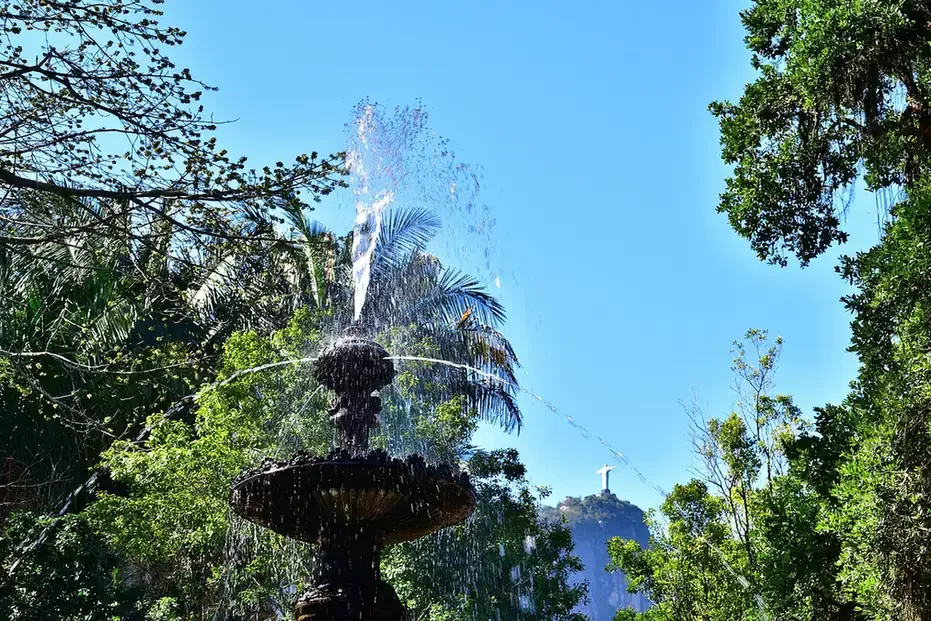 The fountain and royal palms of the Botanical Garden with Christ the Redeemer beyond, Rio de Janeiro