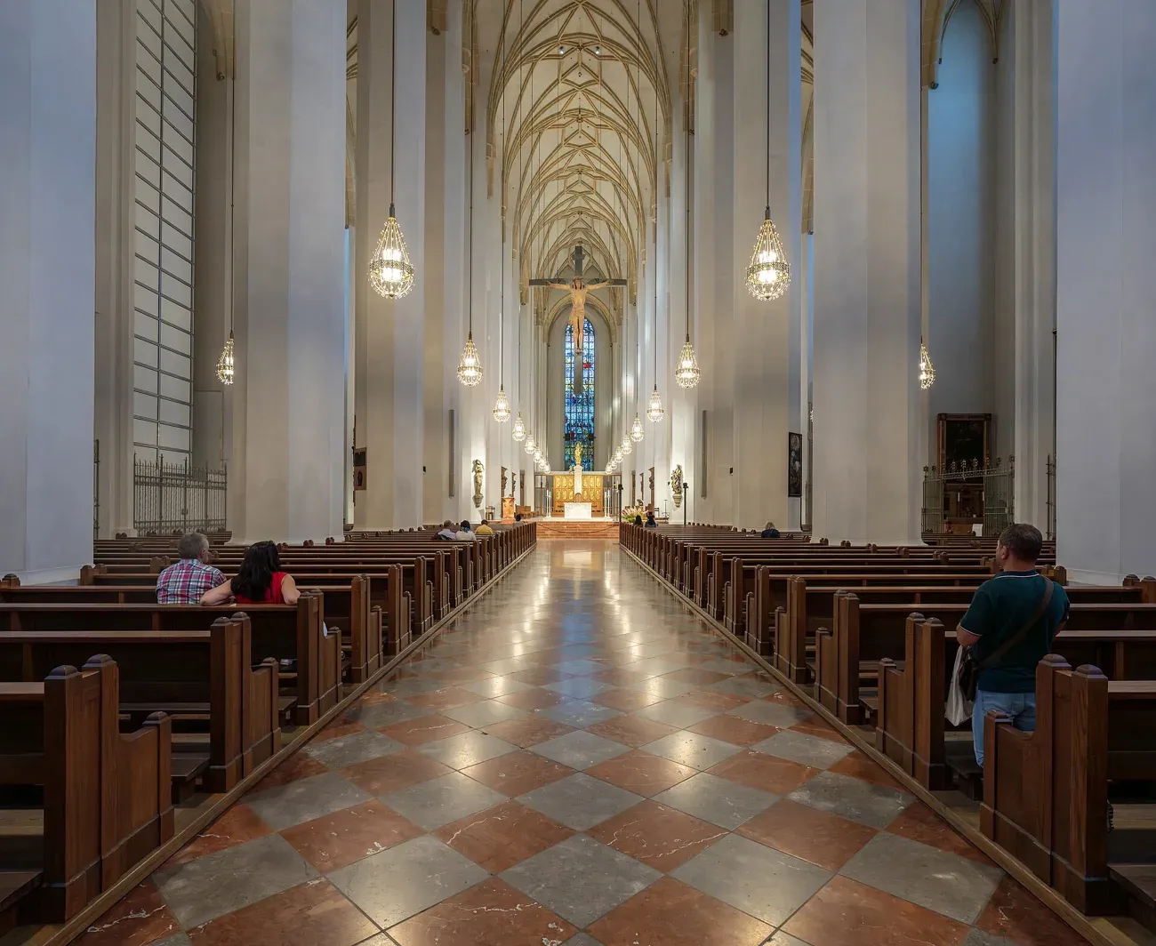 The long white nave of the Frauenkirche looking towards the altar in Munich