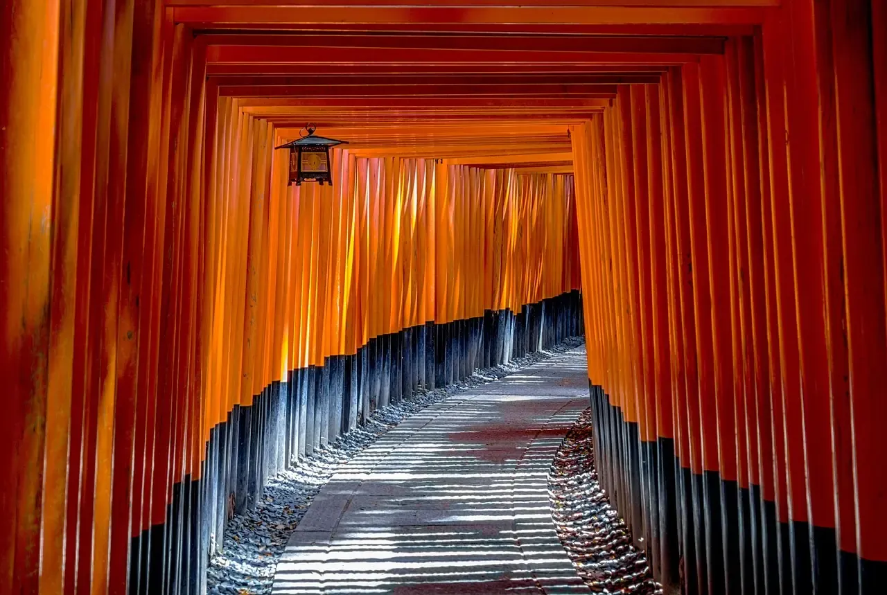 A corridor of torii gates climbing Mount Inari at Fushimi Inari-taisha in Kyoto