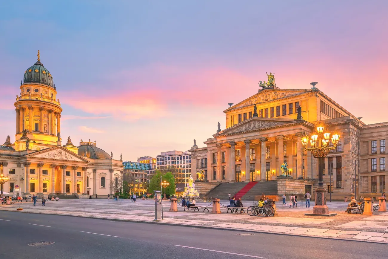 Gendarmenmarkt square in Berlin Mitte with the Konzerthaus and a cathedral at dusk