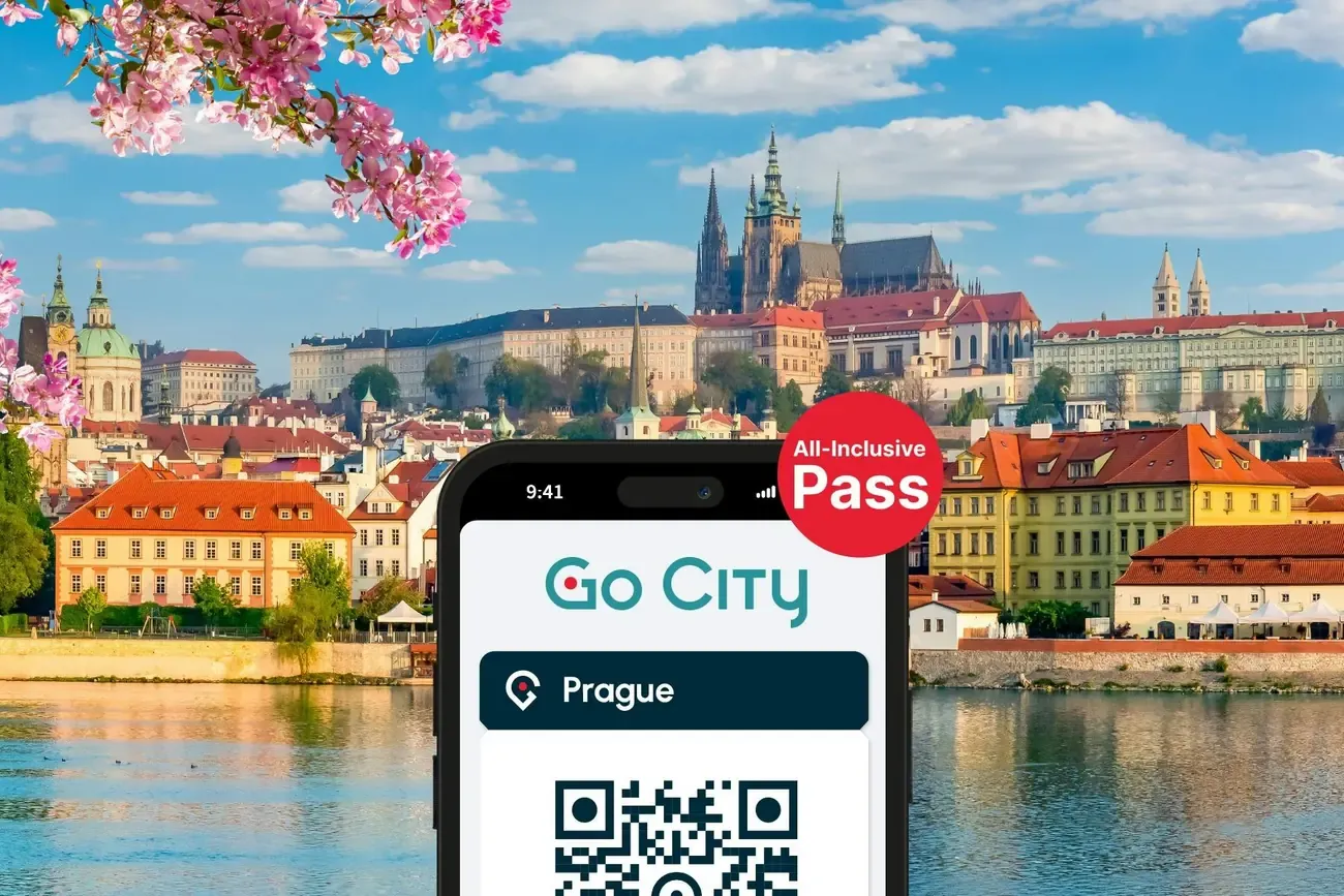 The Go City Prague pass open on a phone above the river and the castle
