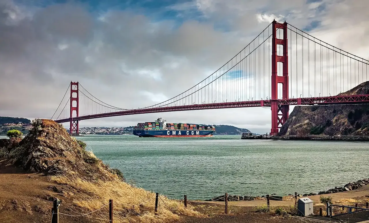 A container ship passing under the Golden Gate Bridge in San Francisco