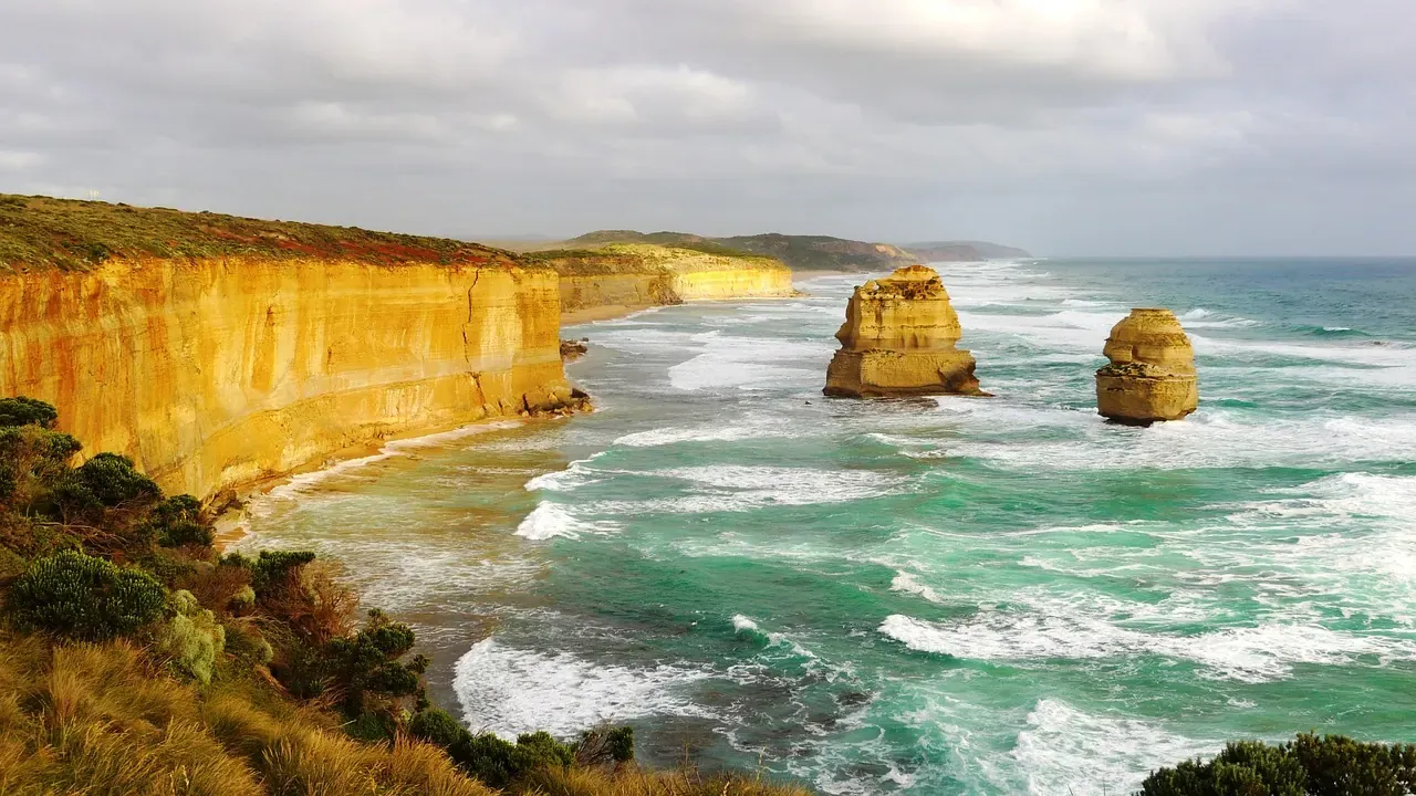 Ochre cliffs and breaking surf along the Great Ocean Road coast in Victoria