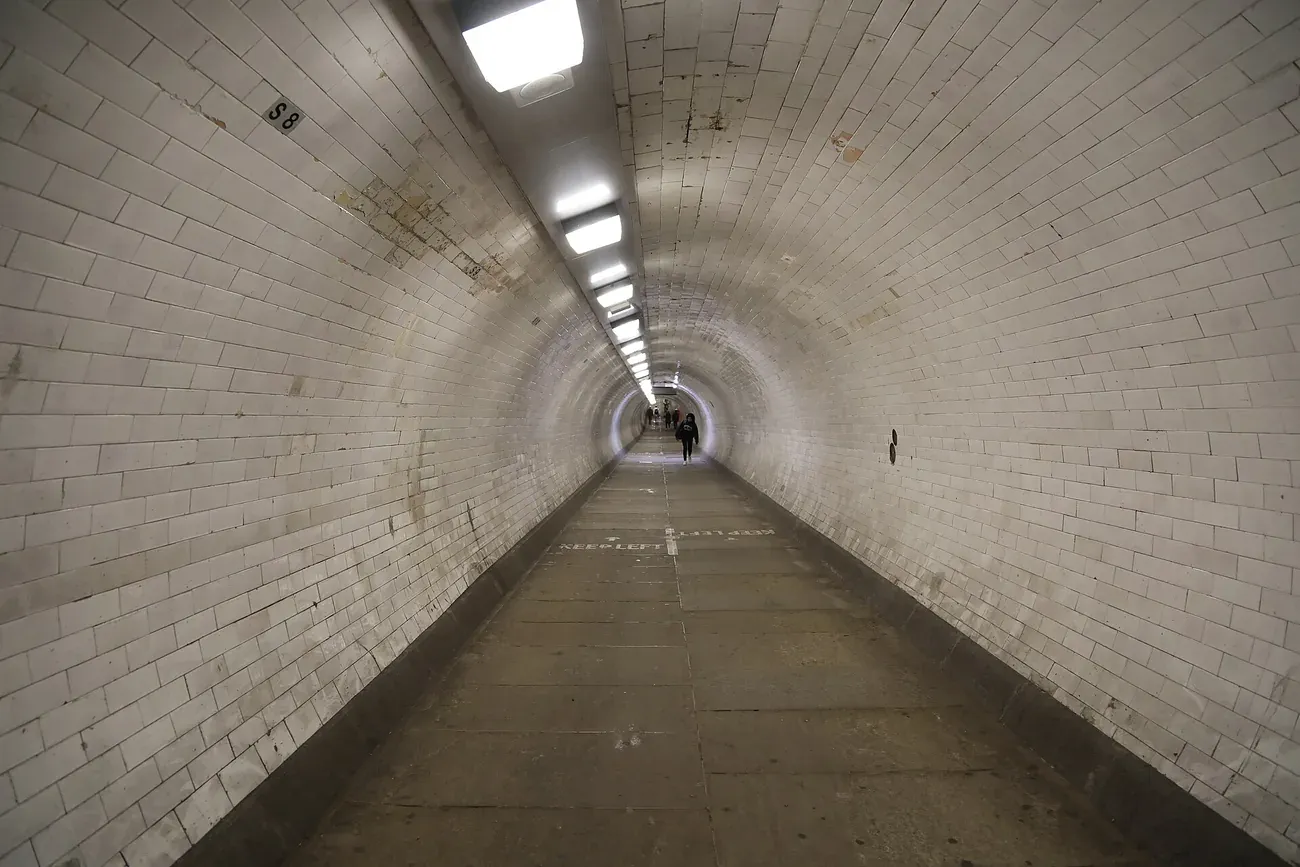 The tiled interior of the Greenwich Foot Tunnel under the Thames in London
