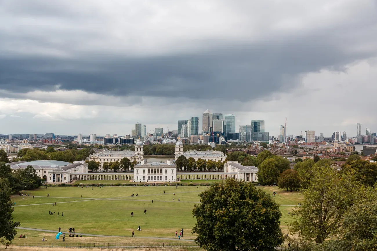 View from the Royal Observatory hill in Greenwich Park over the Queen's House to the towers of Canary Wharf