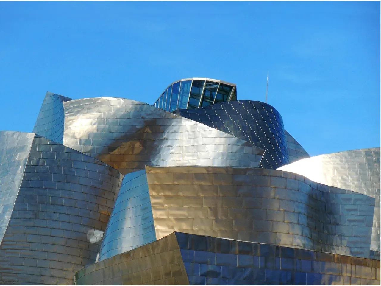 Titanium panels curving across the Guggenheim Museum Bilbao