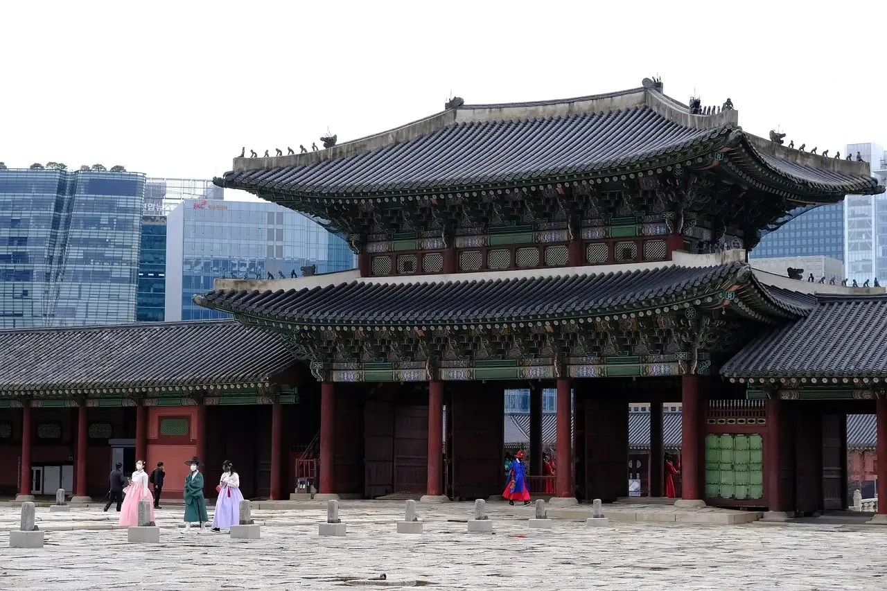 Visitors in hanbok in front of an inner gate of Gyeongbokgung Palace in Seoul