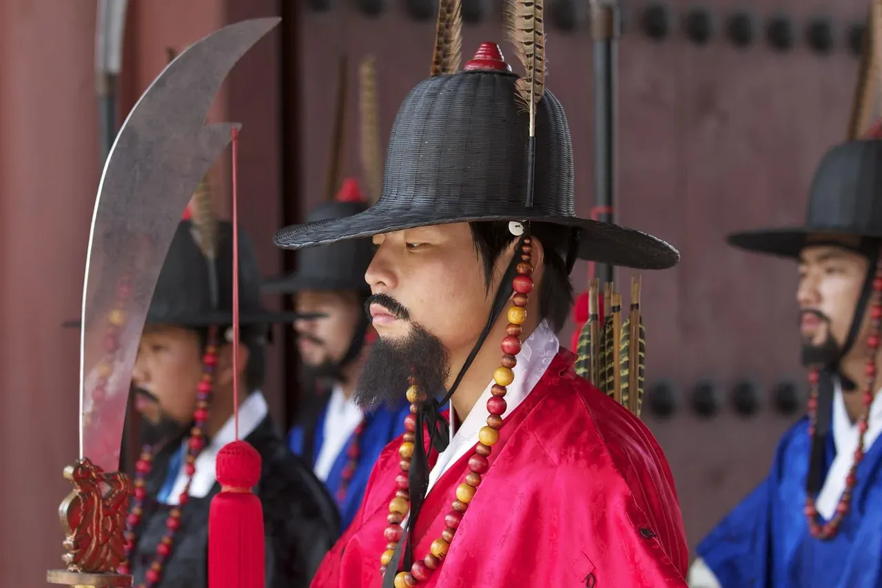 Royal guards in red robes and black hats at Gyeongbokgung Palace in Seoul