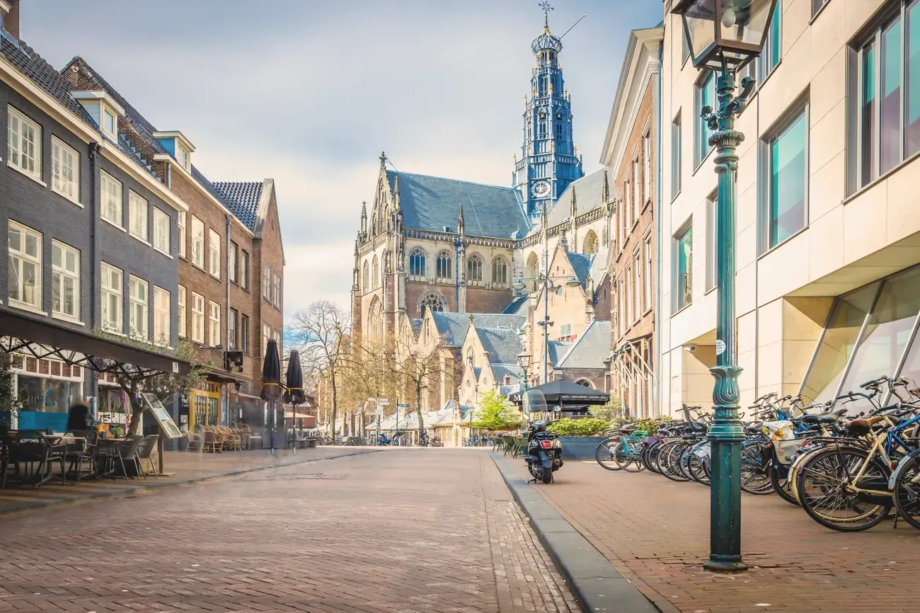 The Gothic Grote Kerk (Sint-Bavokerk) rising above a street in Haarlem, Netherlands