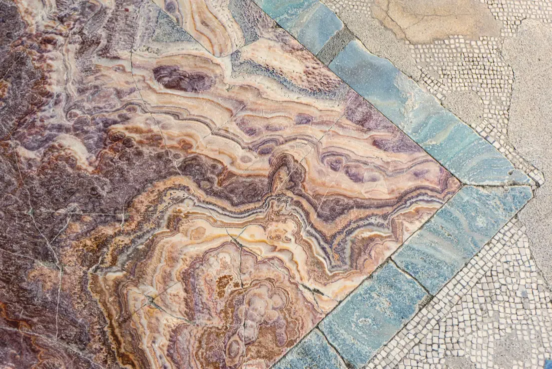 Close-up of an ancient marble and mosaic floor at Herculaneum