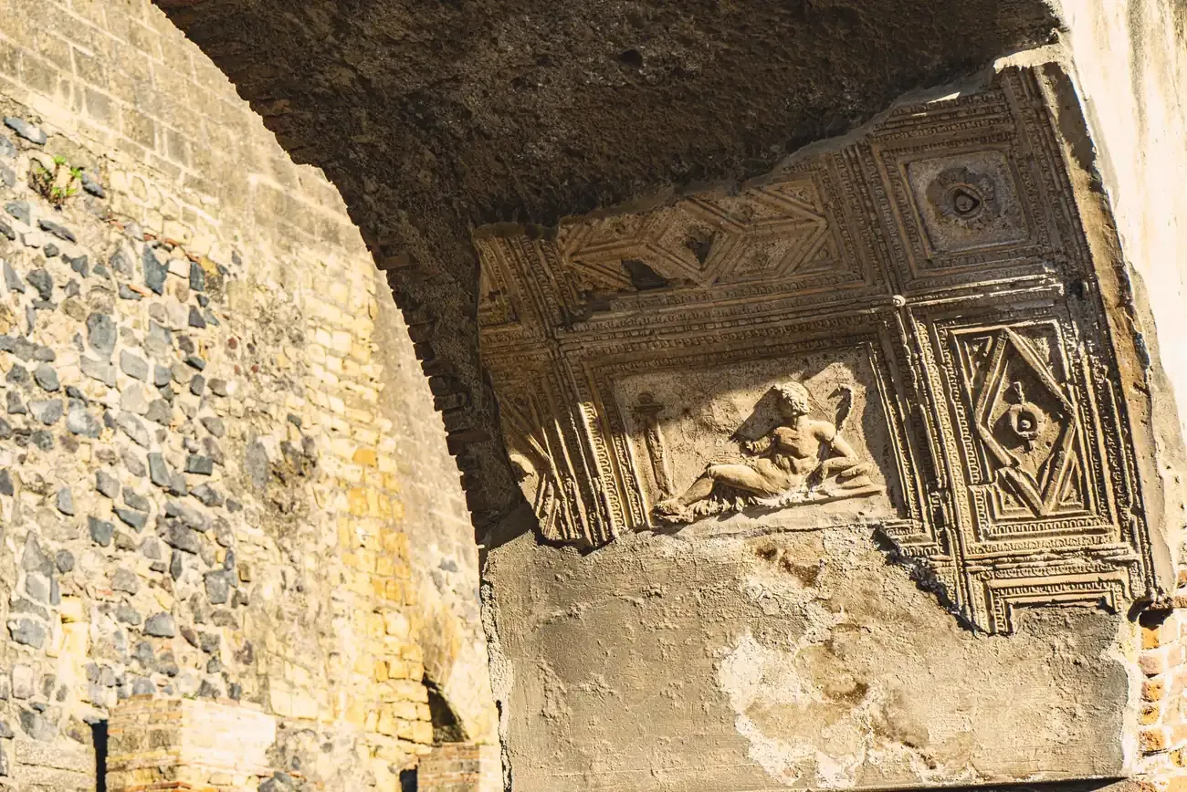 Detail of an ancient stucco relief sculpture inside a house at Herculaneum