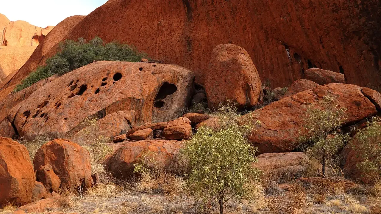 Honeycombed sandstone boulders at the base of Uluru in the Northern Territory