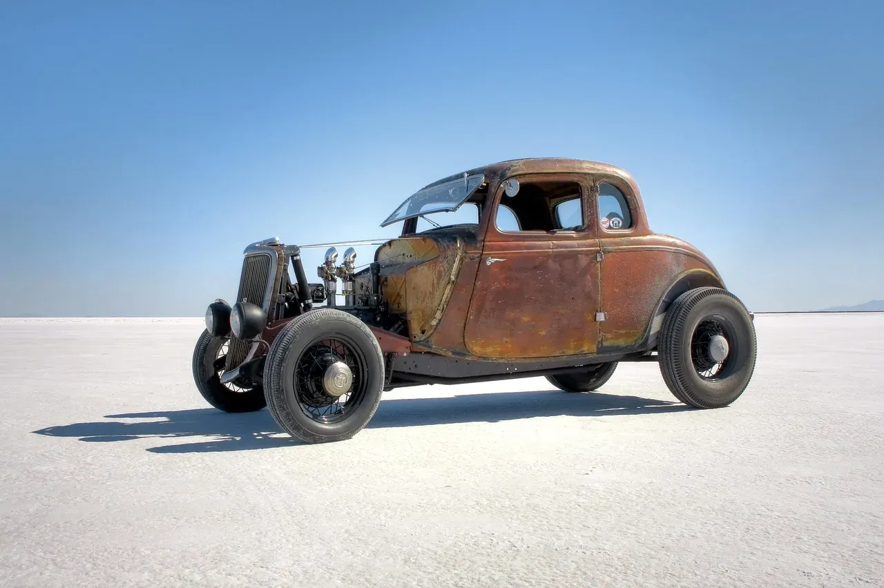 A hot rod parked on the white crust of the Bonneville Salt Flats in Utah