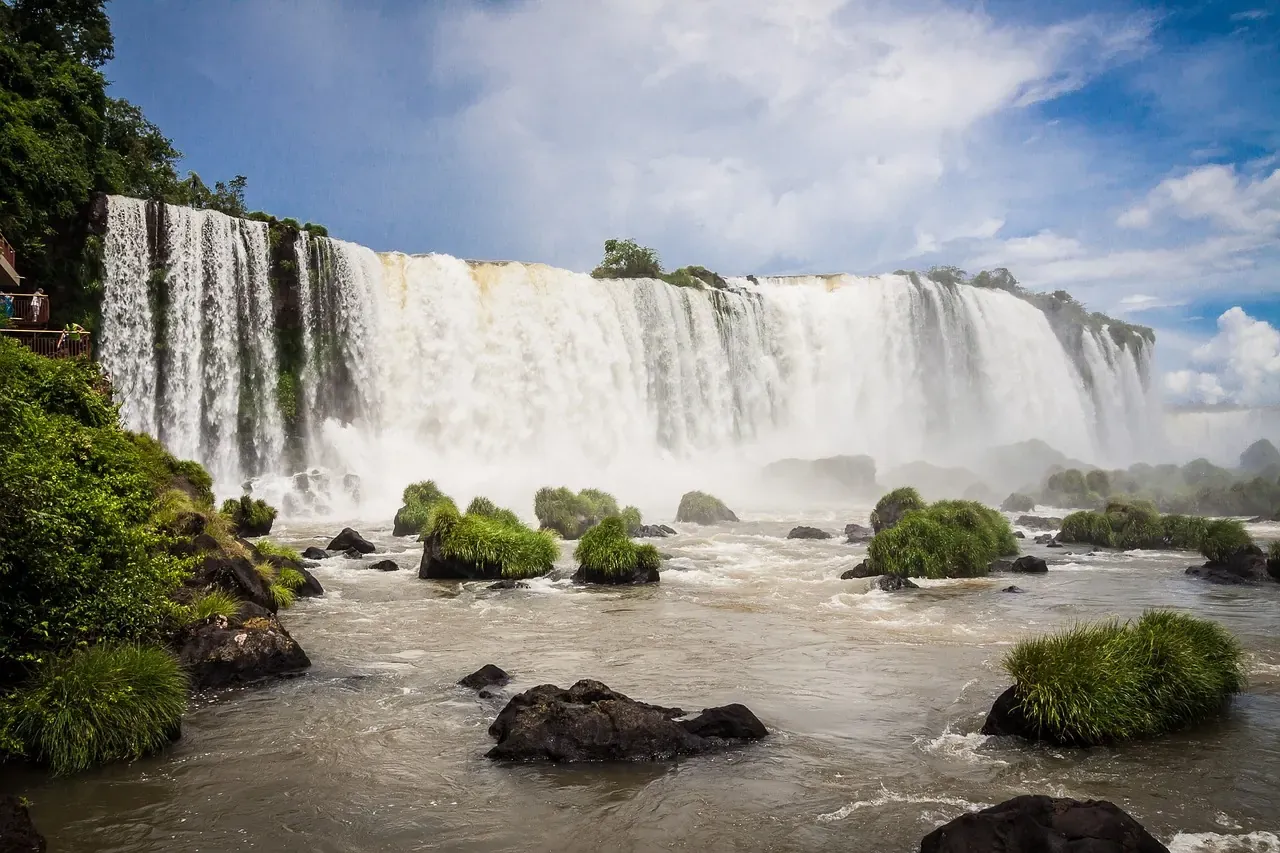 The Iguazu Falls spread across the forest on the Brazilian side in Parana