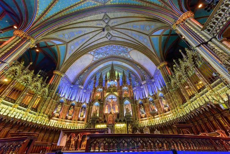 The ornate blue and gold interior of Notre-Dame Basilica in Montreal
