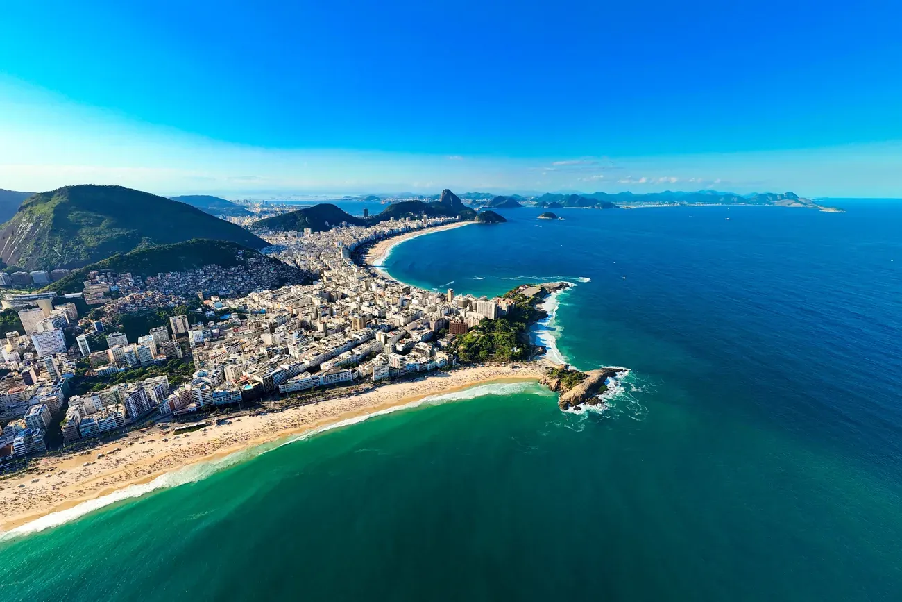 Aerial view of Ipanema and Copacabana beaches meeting at the Arpoador headland, Rio de Janeiro.