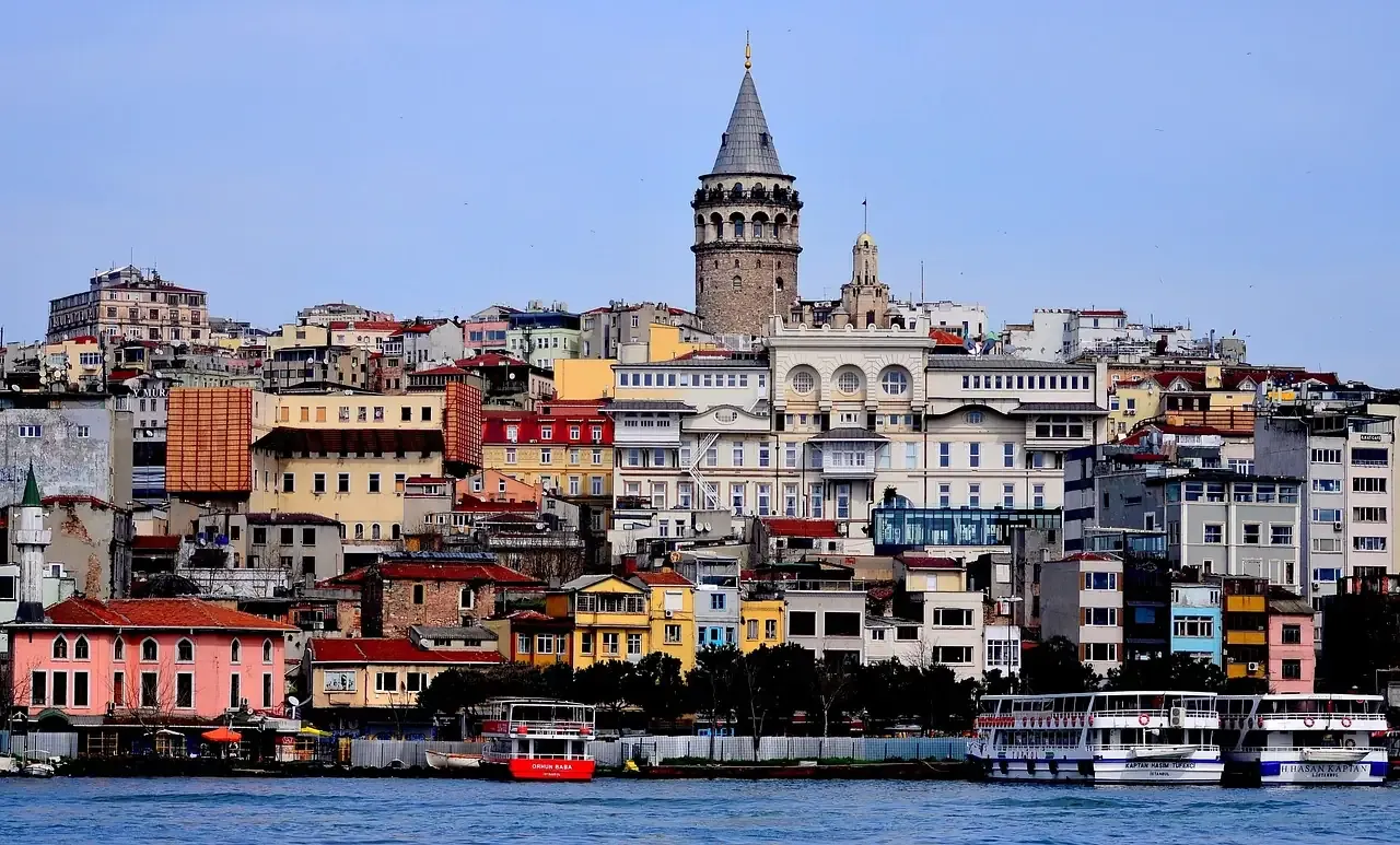 The Galata Tower above the painted houses of the Karakoy waterfront in Istanbul